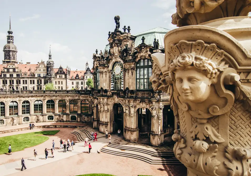 A Statue on a Wall of a Courtyard in Dresden