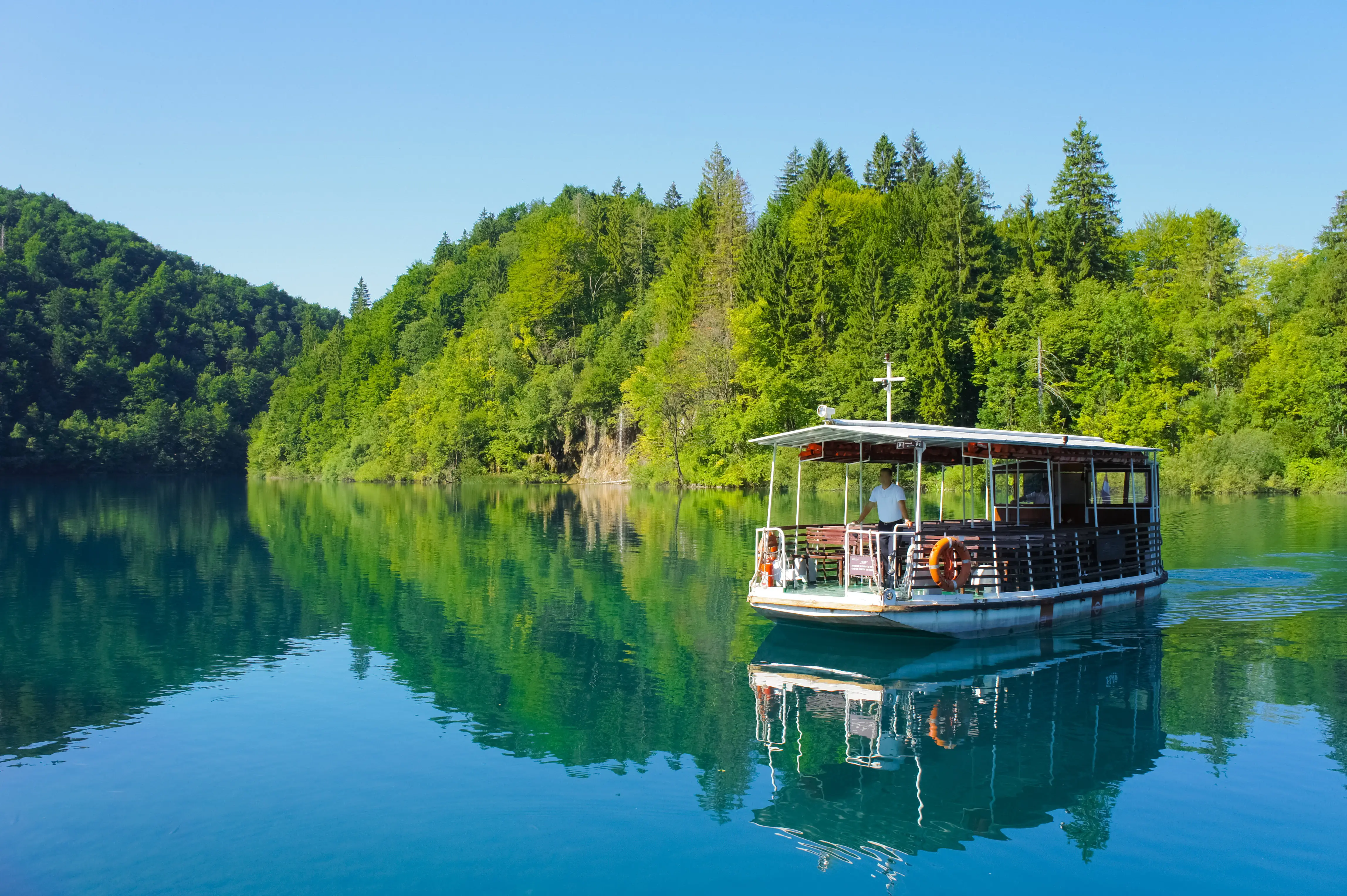 A Small Open Sided Boat on a Lake 