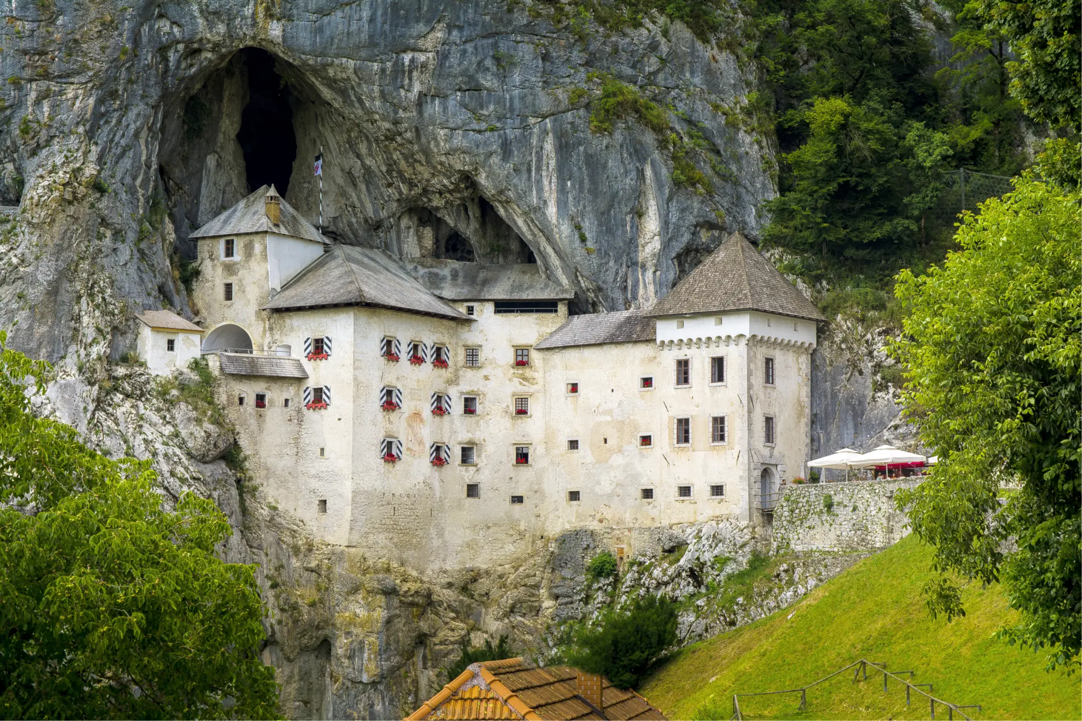 The Mouth of a Cave with a Castle Inside It