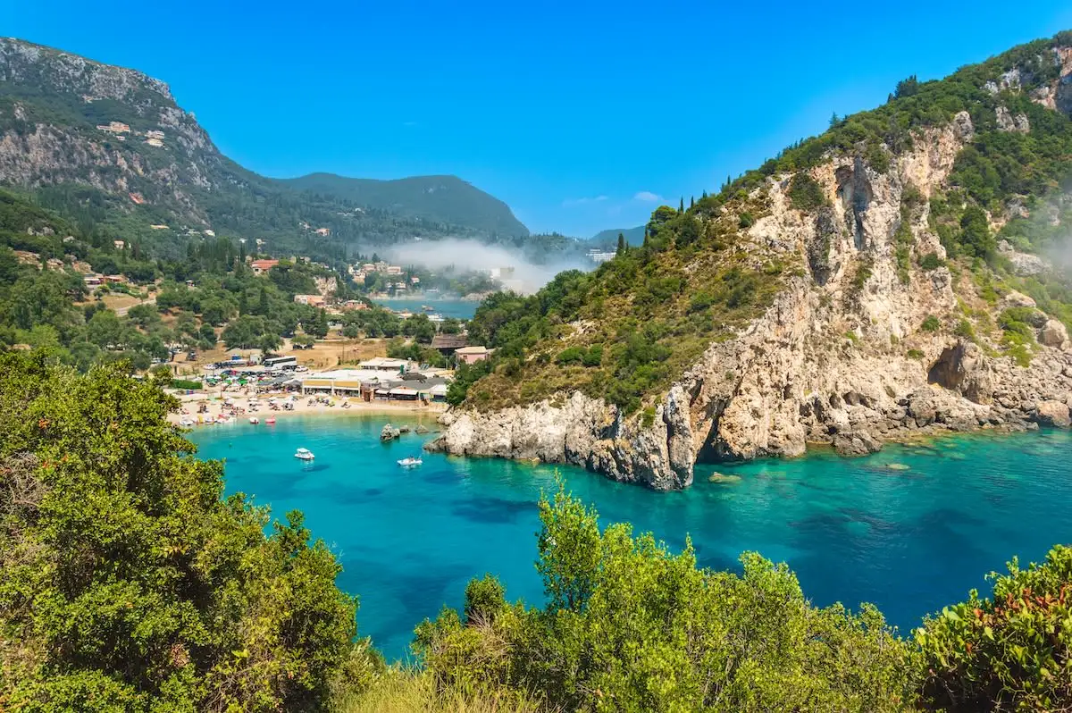 view of cove at paleokastritsa with beach and rocky hill