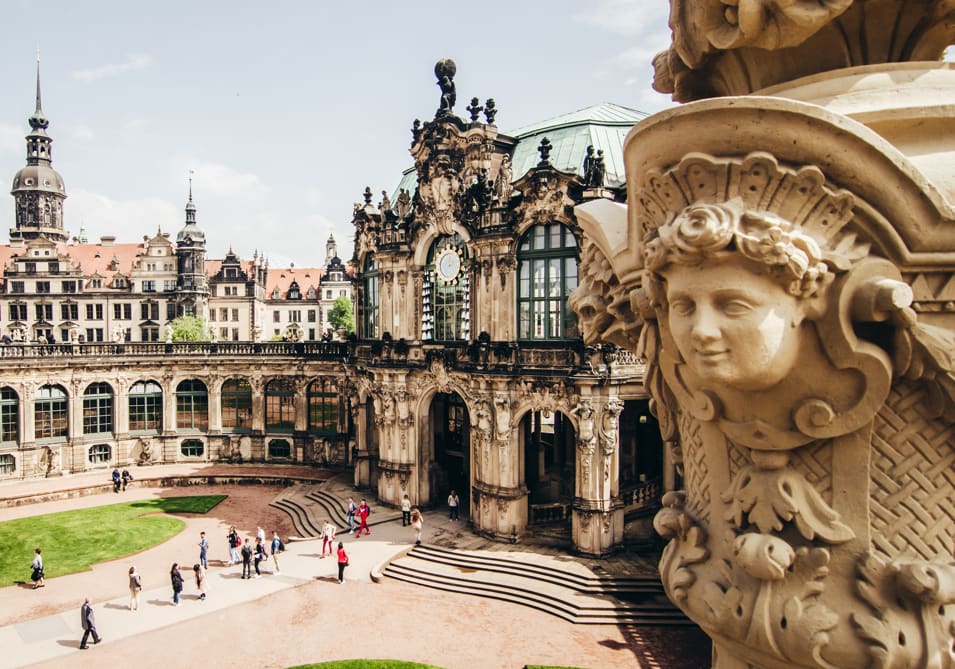A Statue on a Wall of a Courtyard in Dresden