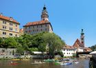 Canoes and Rafts Floating Down the Vltava River in Cesky Krumlov