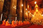 Monks in Orange Praying in Wat Pho Bangkok
