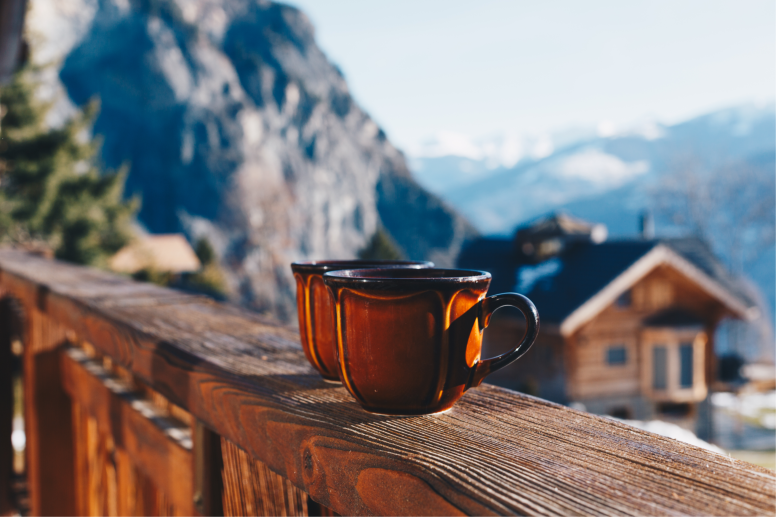 Coffee Mugs on Ledge with Interlaken Mountain Backdrop