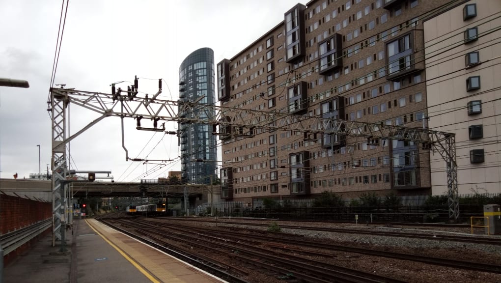 Exterior view of an overhead gantry for the Elizabeth Line