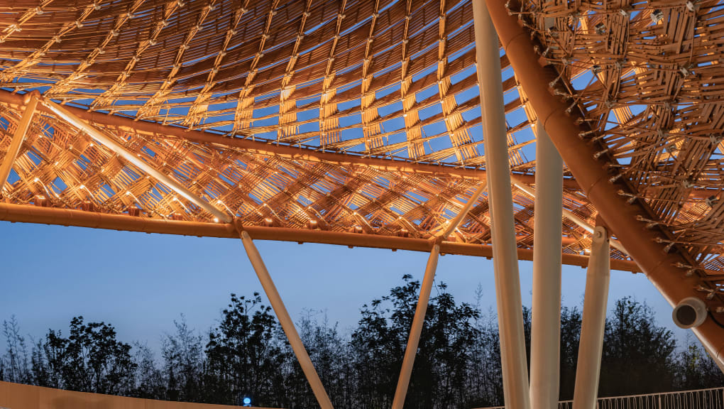 Interior view at night of the Bamboo and Rattan Pavilion of the 10th China Flower Expo