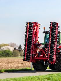 Kverneland F35 compact travelling on road with tractor