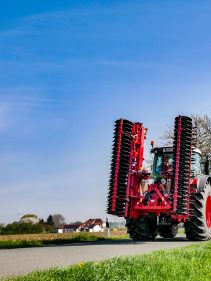 Kverneland F35 compact travelling on road with tractor