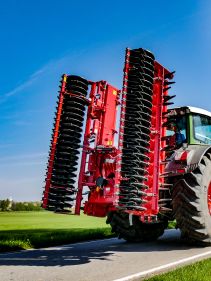 Kverneland F35 compact travelling on road with tractor