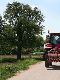 Kverneland Miniair Nova transported on road by tractor