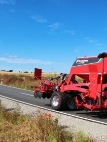 Kverneland U-drill, transported on road by tractor