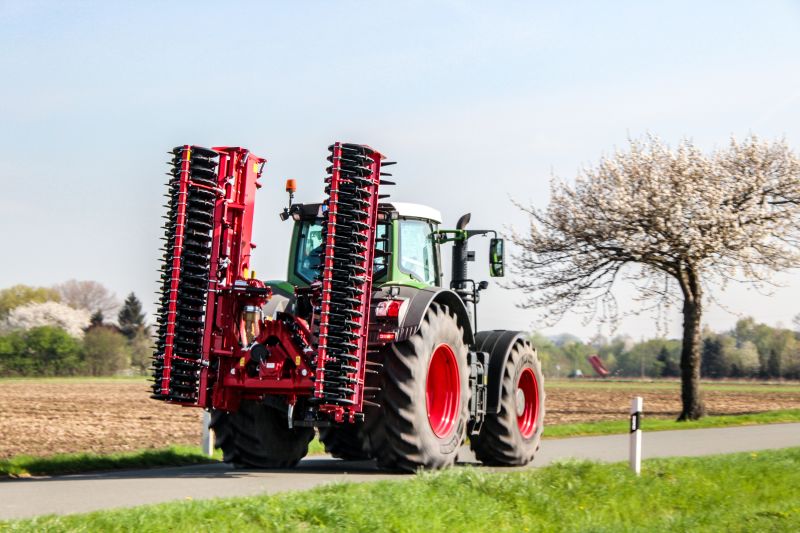 Kverneland F35 compact travelling on road with tractor