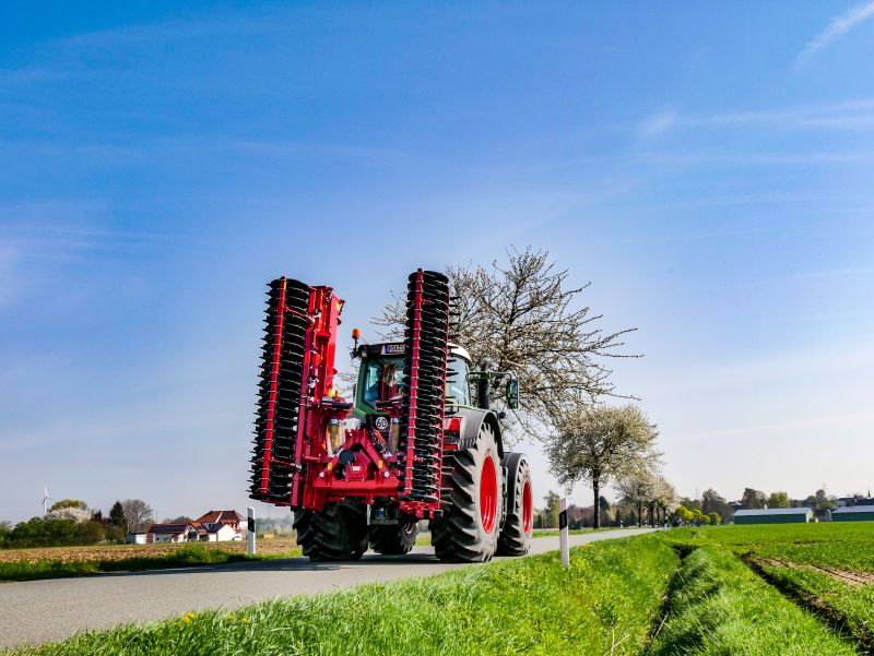 Kverneland F35 compact travelling on road with tractor