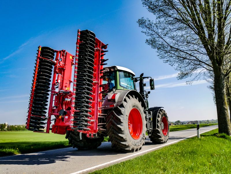 Kverneland F35 compact travelling on road with tractor