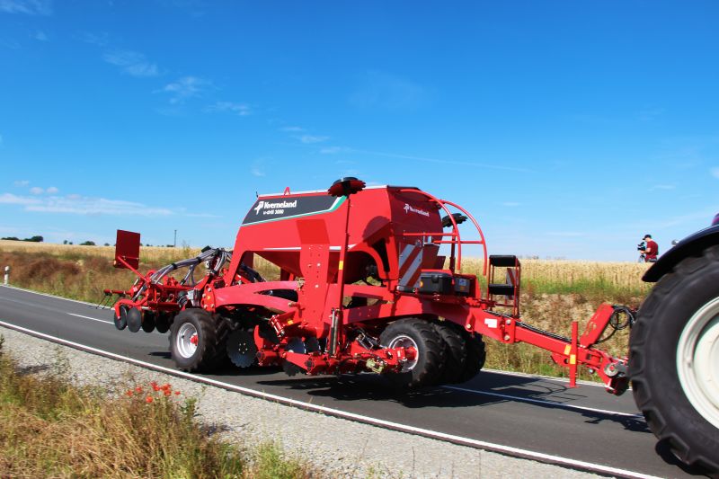 Kverneland U-drill, transported on road by tractor