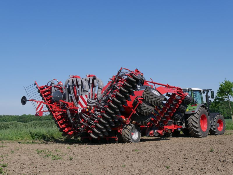 Kverneland U-drill, transported on road by tractor