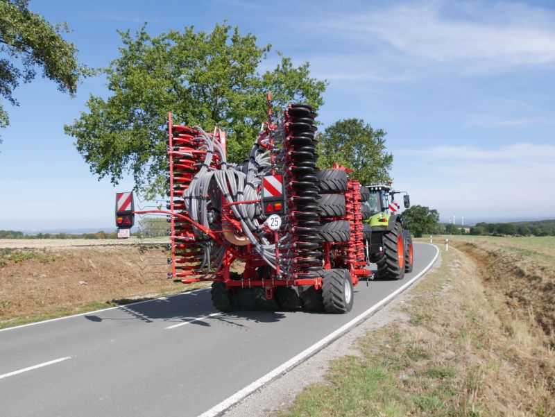 Kverneland U-drill, transported on road by tractor