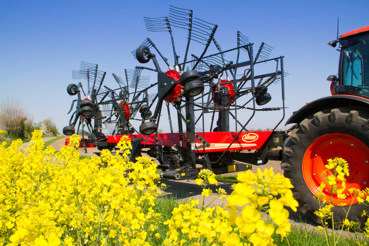 Four Rotor Rakes - VICON ANDEX 1254 - 1304, folded during safe and efficient transportation by tractor