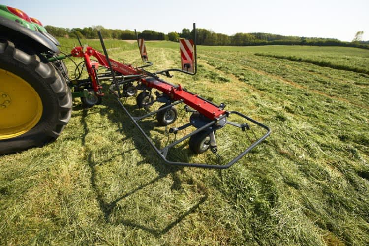 mounted tedders - vicon fanex 604 - 804 operating efficiently on field during operation