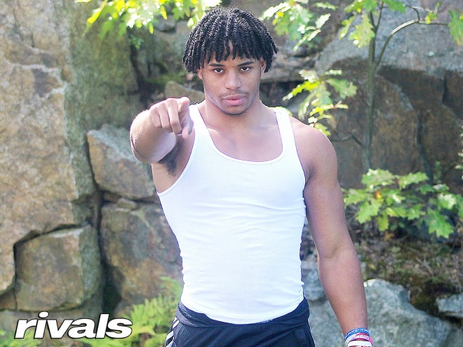 New England athlete Joenel Aguero holds a Michigan Wolverines football recruiting offer.