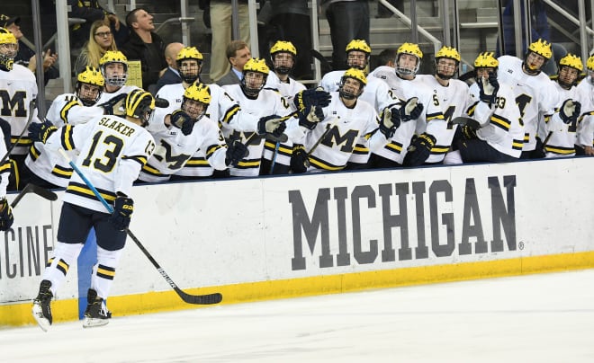 Michigan Wolverines hockey forward Jake Slaker receives congratulations for a goal