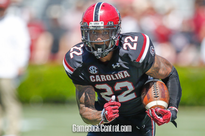 Jamari Smith runs with the ball during the Garnet and Black spring game.