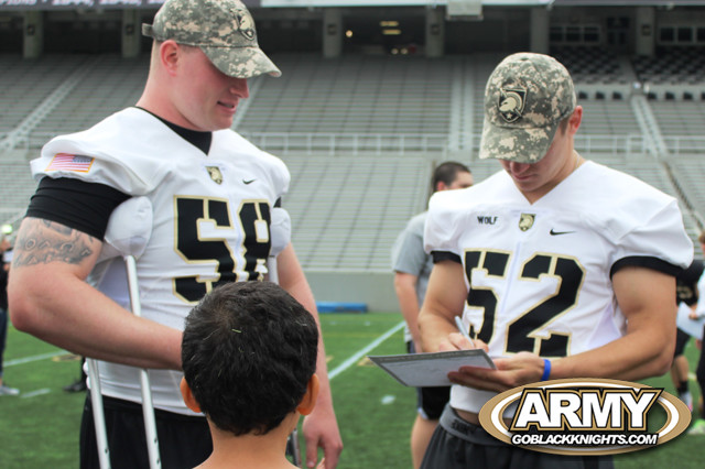 McLean & Wolf signing autographs after the spring game