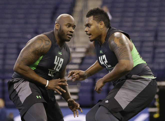 Ole Miss offensive lineman Laremy Tunsil, left, and Notre Dame offensive lineman Ronnie Stanley run a drill at the NFL football scouting combine on Friday, Feb. 26, 2016, in Indianapolis. 