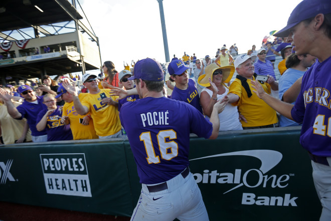 LSU pitcher Jared Poche' (16) celebrates with fans after defeating Rice