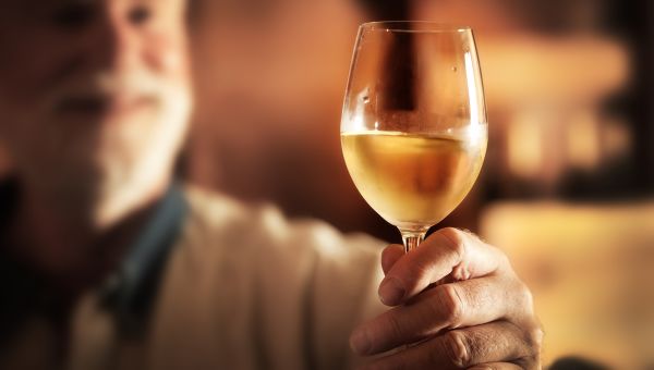 man holding wine glass