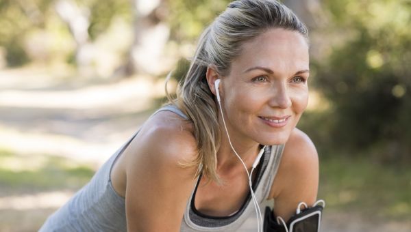 middle aged woman resting after a jog