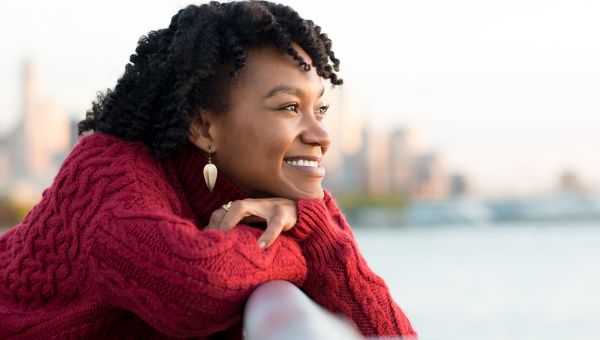 woman standing outside smiling