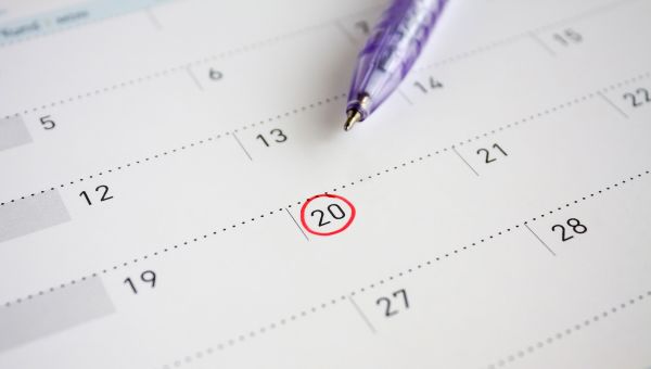 purple pen, calendar, circled date
