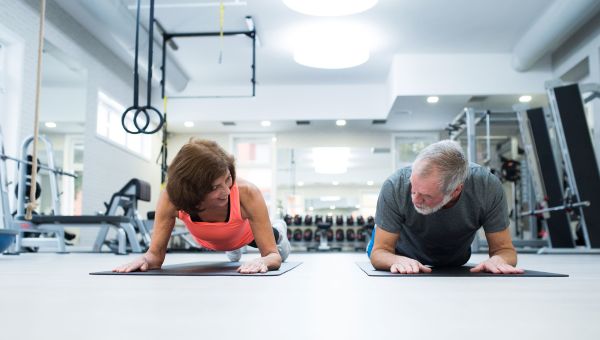 mature couple, exercise, working out, plank, gym