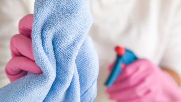 pink gloves, blue towel, spray bottle, cleaning