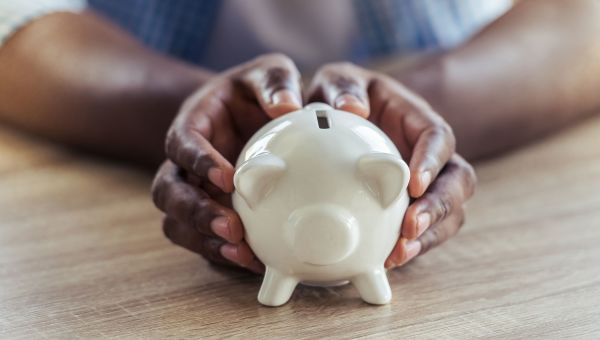 piggy bank, hands, desk