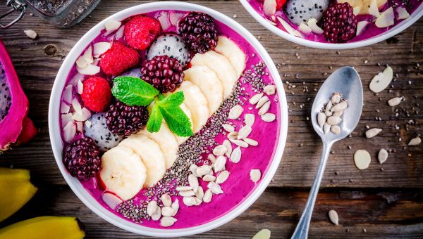 berries, nuts, seeds, almond slices, bowl, spoon, blackberries, raspberries, smoothie bowl