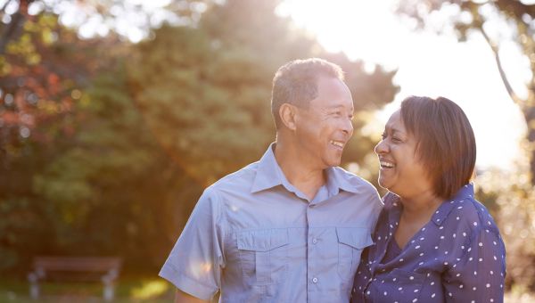 mature couple standing in yard