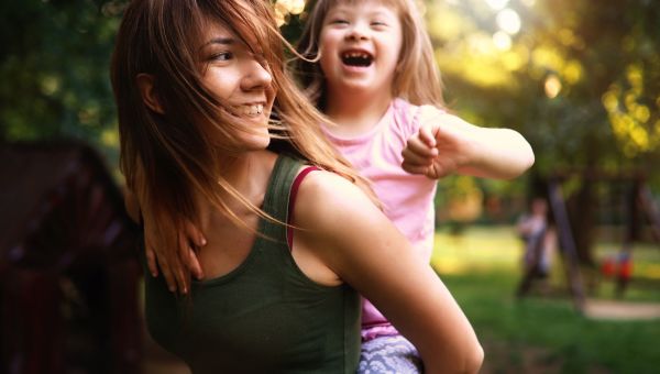 young mother spending time with special needs child