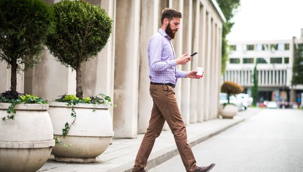 man walking with cell phone