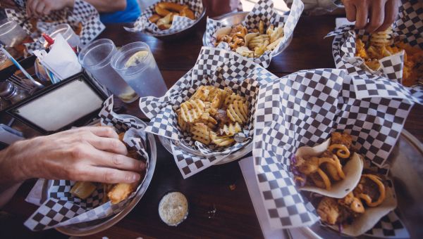 french fries and other baskets of fried food