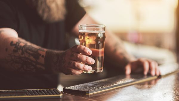 Man drinking glass of beer
