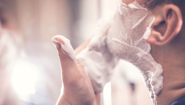 man shaving face