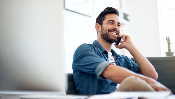 man smiling on phone