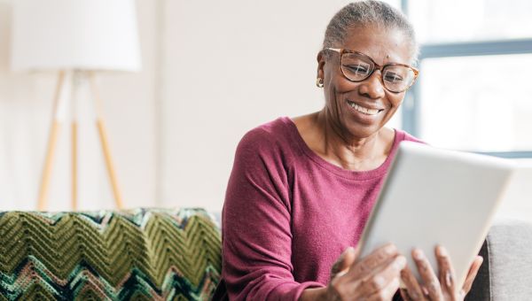 mature woman looking at tablet