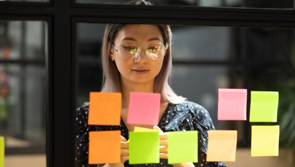 young woman writing notes