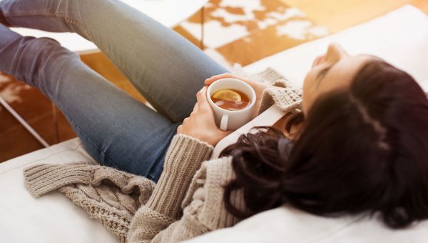 woman holding a cup of tea