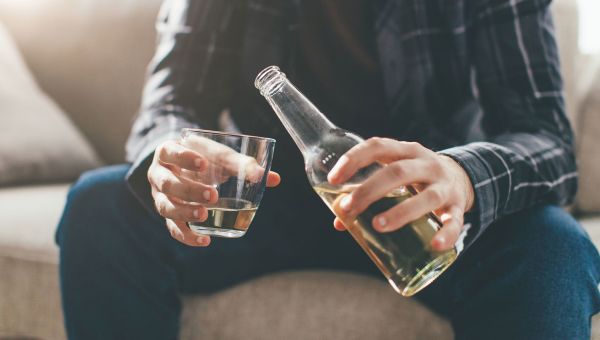 man drinking alcohol