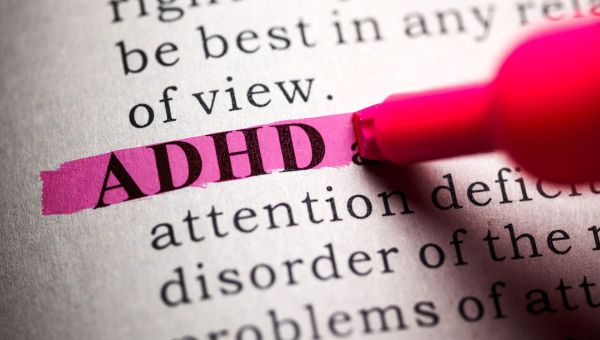 Definition of ADHD highlighted in pink in a book.