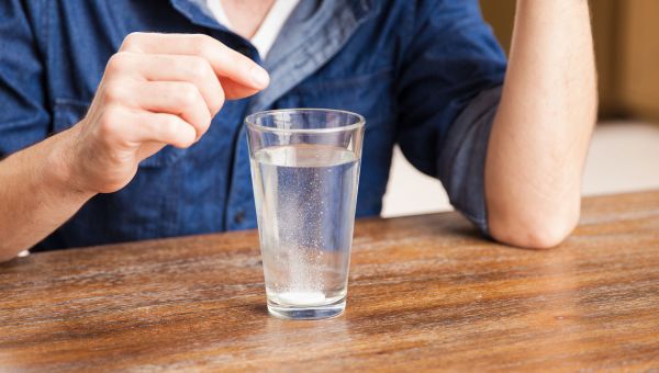 Tablet dissolving in a glass of water